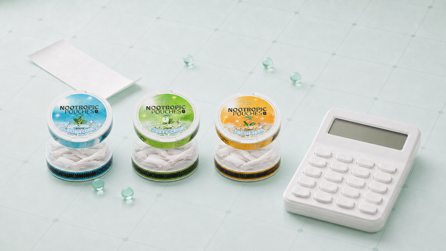 Blue, green, and yellow open Kryze nootropic pouch tins beside a calculator and blank receipt