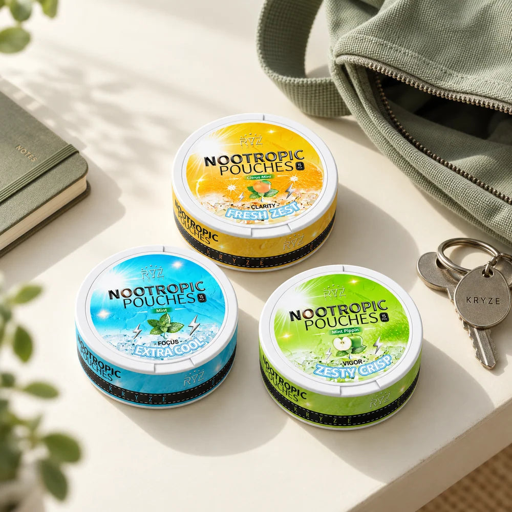 The three Kryze flavors beside an everyday bag, notebook and keys